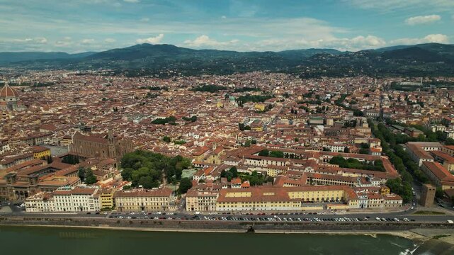 Florence seen from above, reveals a tapestry of picturesque architecture, weaving history and beauty under the Italian sun