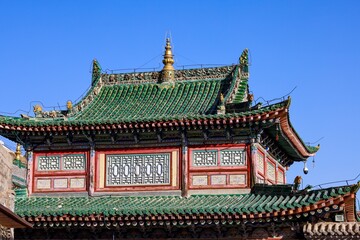Intricate Tibetan and Chinese architectural details of the Kumbum Monastery (Ta'er Monastery) showcasing traditional design in Qinghai/Amdo region, Tibet.
