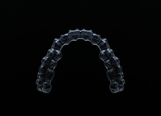 Treatment with clear aligners by a dental orthodontic specialist. Alignment of misaligned teeth known as aligner therapy. © UniqDream
