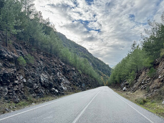 Fototapeta premium mountain road in autumn colors of nature. High quality photo