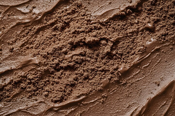 Fototapeta premium Cocoa powder surface close-up in color of the year 2025 mocha mousse