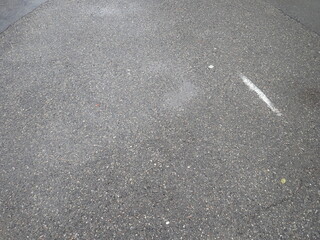 Fototapeta premium asphalt road with broken cracks after rain
