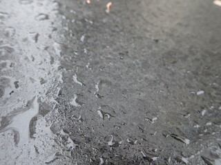 rain drops on a grey surface