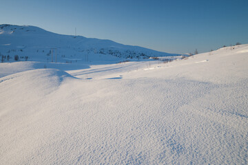 evening light over a beautiful winter landscape in norway