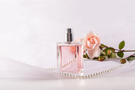 Square perfume bottle with rose and pearl accessories
