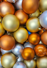 A bunch of colorful ornaments with glitter on them. Christmas tree balls