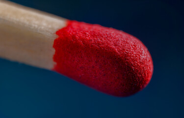 Red match in macro. close up of a red match