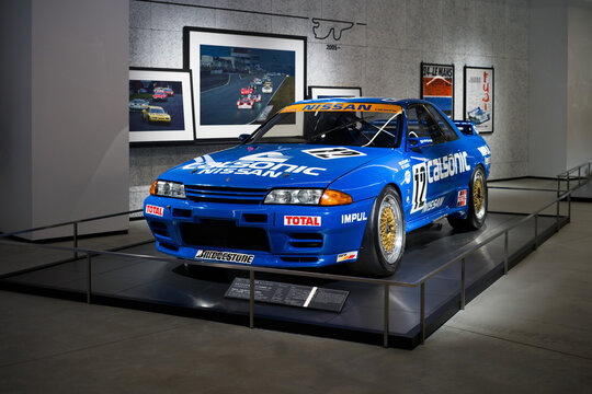 FUJI, JAPAN - 23 NOVEMBER 2024: ON DISLPAY AT THE FUJI SPEEDWAY MOTOR MUSEUM, VINTAGE MOTORSPORT ICON, THE CALSONIC NISSAN SKYLINE R32 GT-R, FRONT VIEW OF WHOLE CAR WITH HEADLIGHTS, BUMPER, HOOD