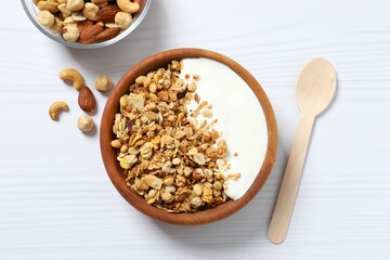 Delicious granola with yogurt on a light background