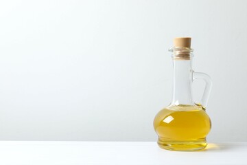 Bottle of fresh oil on white background