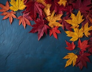 Top view of scattered autumn leaves with vibrant colors on an isolated blue textured shiny slate wall background, highlighting the natural beauty of fall copy space for text

