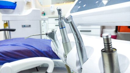 Patient chair used by  professionals for treatment and tools used by doctors in dental procedures. Dental treatment instruments and dental clinic. dental hospital and clinic
