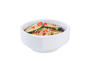 Cucumber spicy asian salad in a bowl on a white isolated background