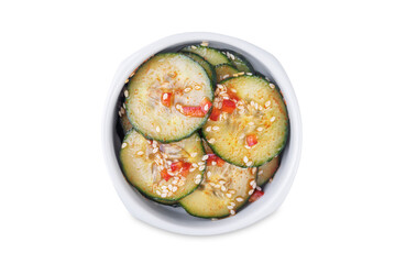 Cucumber spicy asian salad in a bowl on a white isolated background