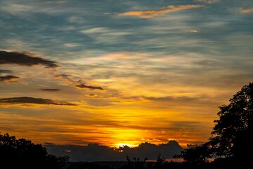 Sunrise with intense natural orange lights and idyllic dramatic scenery