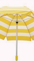 Fototapeta premium A simple composition featuring a vibrant striped beach umbrella on a white backdrop
