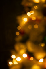 Fototapeta premium bokeh lights on a Christmas tree holiday background