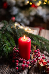  red Christmas Candle on rustic wood
