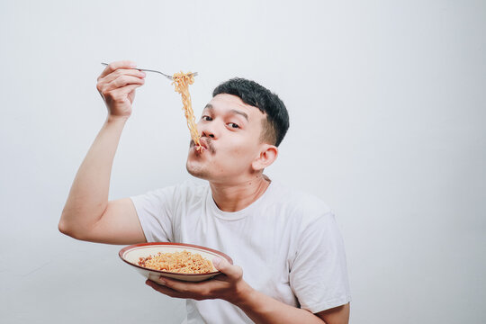 Delightful Noodle Feast: An Enjoyable Moment Captured with a Happy Food Lover
