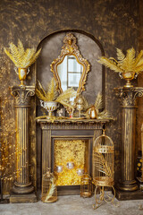 interior in gold color. artificial fireplace with lights
