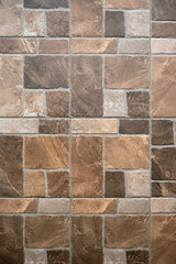 Textured ceramic floor tiles with a stone-like appearance