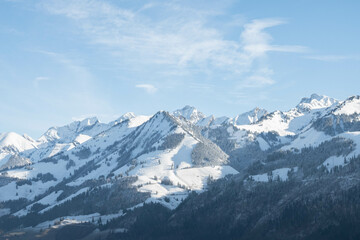 Alpine white mountains in Switzerland winter on a sunny day