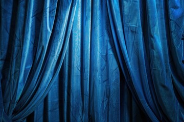 Blue curtain in various folds of blackout sackcloth fabric spotlight in theater background