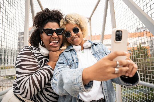 Dominican lesbian couple taking a selfie together