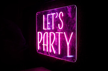 Neon Let's Party sign adds a festive touch to any event