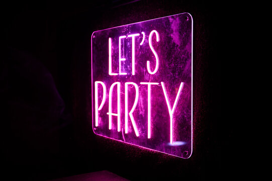 Neon Let's Party sign adds a festive touch to any event