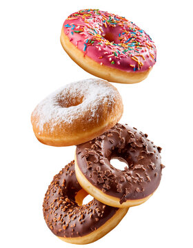 Four delicious donuts falling on transparent background