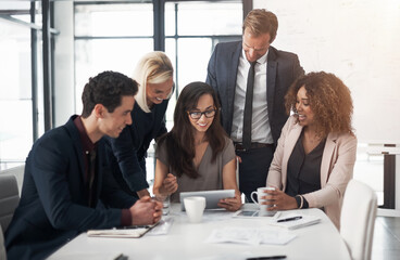 Group, business people and tablet with discussion, collaboration or coworking in office or meeting. Women, men and technology for brainstorming, teamwork or review in project management as colleagues