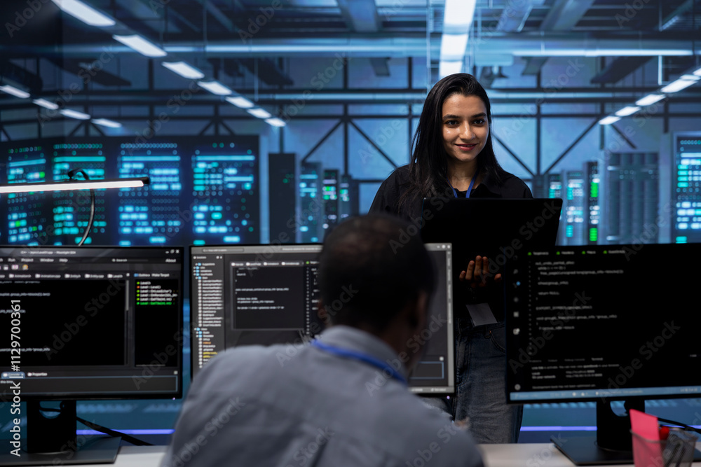 Poster manager overseeing engineers checking for signs of imminent failure in data center equipment. team l