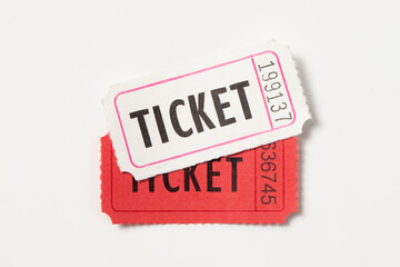 One red and white vintage admission tickets