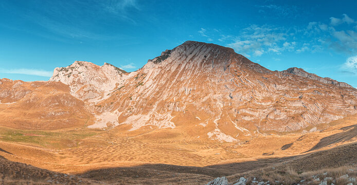 Majestic mountain peak Prutas in Durmitor national park dominating the landscape under a vibrant blue sky, travel destinations in Montenegro