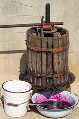 Wine making. Technology of wine production in Moldova. The ancient folk tradition of grape processing. The squeezer is used to press the wine.