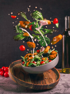 Creative levitation of ingredients in fresh salad composition