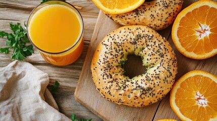 Fresh Bagel with Poppy Seeds and Orange Juice on Rustic Wooden Table