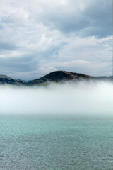 Mountains by the sea with natural fog. 