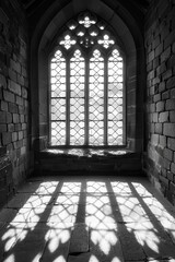 Gothic Window Illuminates Stone Room With Light And Shadow