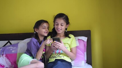 Girls watching mobile phone. sstkTechnology addiction knowledge screentime parents children young autism digital wellbeing future indian content online fraud gaming reels video chatting mental health - Powered by Adobe