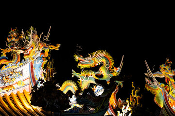 the gorgeous dragon pattern decoration shines brightly under the night sky