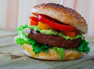 Healthy vegetarian hamburger made with soybean cutlet and salad