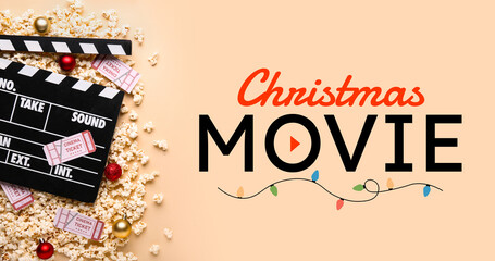 Movie clapper with popcorn, cinema tickets and Christmas tree balls on beige background