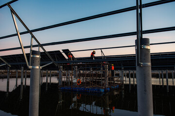 Naklejka premium Solar power plants. Sustainable renewable energy and modern photovoltaic technology are used for environmentally friendly electricity production. The concept of solar power generation.