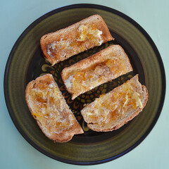 Toasted wholemeal bread with butter and English marmalade.