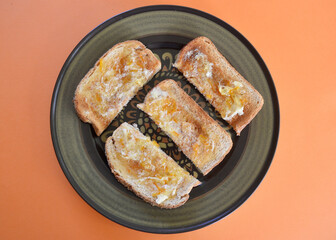 Toasted wholemeal bread with butter and English marmalade.