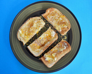 Toasted wholemeal bread with butter and English marmalade.