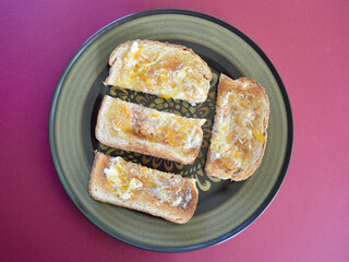 Toasted wholemeal bread with butter and English marmalade.
