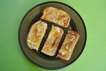 Toasted wholemeal bread with butter and English marmalade.